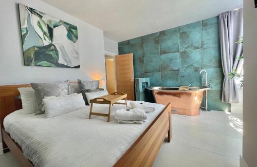 Southbourne Apartment | The Alice Apartment - by Coastline Retreats - Stunning Balcony Apartment with Sea Views - Alice in Wonderland Themed Secret Room - Luxury Copper Bath in Master Bedroom