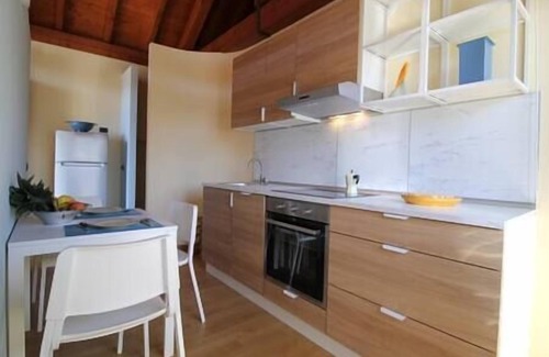 Pettenasco Apartment | The Arch in the sky per 7 persone, Una vista lago unica ed un relax in giardino per godere di quest