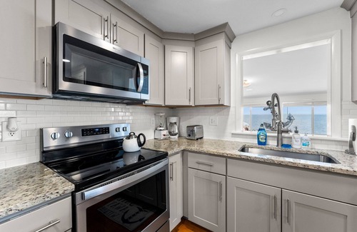 Mount Holly House | The Beach Retreat is a cozy beach Villa with Hottub overlooking a private beach.