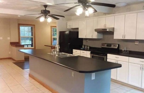 Fort Gay Cabin | The Bunkhouse A two story rustic cabin 3BR 2BA
