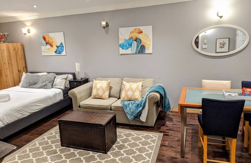St. Vital Apartment | The EthlynGwen- Main Floor with Private entrance and Hot tub