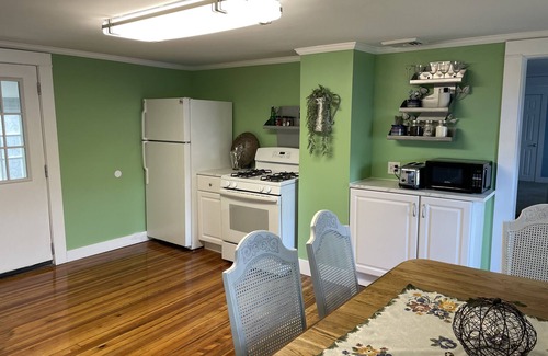 Winchester Apartment | The Inn at Highland Lake, 2nd Floor, waterfront yard with a boat dock