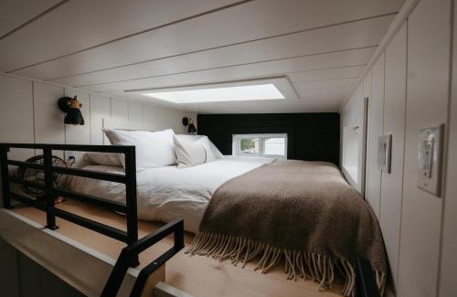 Tyendinaga Mohawk Territory Resort | The Loft - Stargazing Tiny Home with Firepit, Wood Fired Pizza Oven & Movie Projector