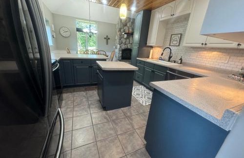 Squaw Lake Resort | The River Condos Hot Tub Fireplace Family & Pet Friendly River Front 2 to 6 bedroom condos dock