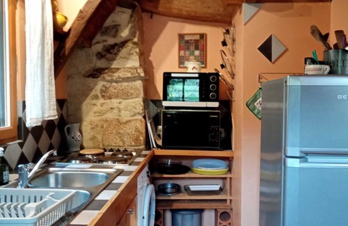 Yzeron Cottage | The yellow cottage, made of stone and wood