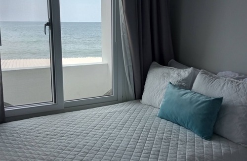 Sector 2 House | Top floor stylish Queen room, balcony with great Caribbean view. Parking,Netflix