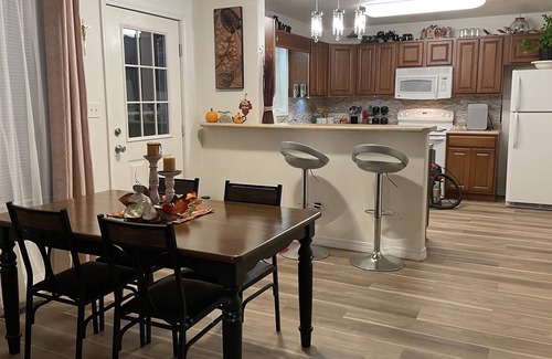 Coffeyville House | Trendy home with a scenic back porch, fish, golf and more
