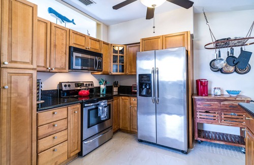 Cypress Point House | Tropical Getaway! Walking distance to beach & dining, private home, heated pool.