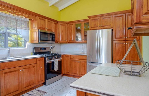 Cades Bay House | Two bedroom, 2 bathroom house in a tropical palm and garden setting.