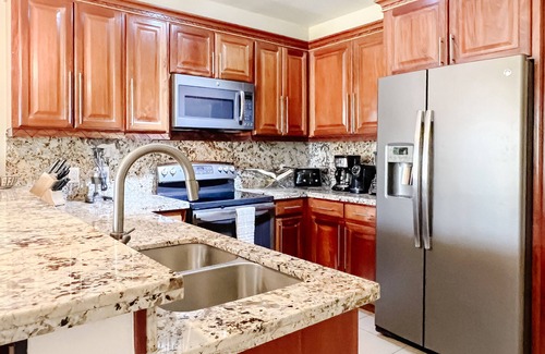 Cocoplum Condo | 'Two Cocos at the Plum' - First Floor Condo with Pier, Pool & Hot Tub
