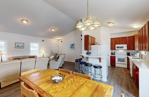 Orange House | Two-story, lakefront getaway with dock, beach, grill, 2 kayaks, 2 canoes, AC
