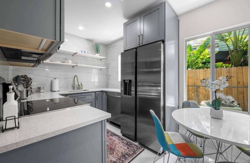 Downtown Fort Lauderdale Apartment | Uhost AI | 1BR Oasis | Modern Design & Patio