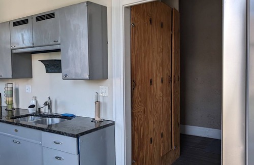 The Gate Apartment | Unique Condo in Historic Building with Rooftop Deck.