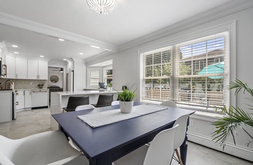 Oakdale House | Updated home with canal & hot tub in backyard. Close to everything!