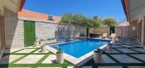East Sumba Villa | Villa Frangepani, Private Pool, 3 Bedroom, 2 Bath, Fully Equipped, Billiard Table, Home theatre, at Sumba Paradise Bech Resort