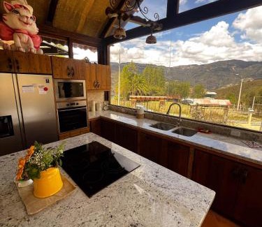 Paute Villa | Villa Nathalie, 2 bedrooms, jacuzzi, king size bed, hammock, FIREPLACE