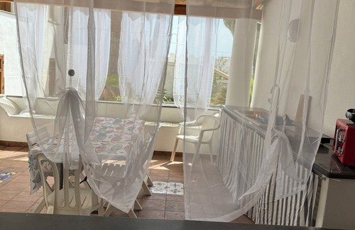 Stromboli Villa | Villa with patio surrounded by greenery, equipped kitchen on the patio. Close to the sea