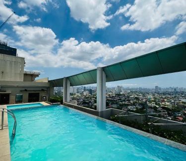 Phil-Am Apartment | Vinia Infinity Studio 2 Near Malls with WiFi Netflix and Karaoke