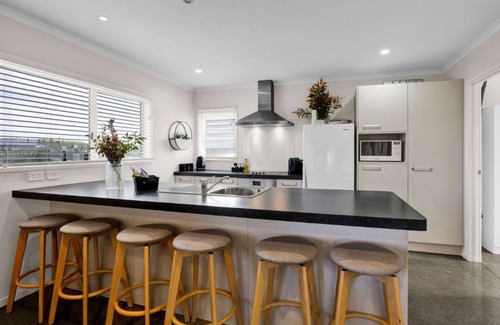Waverley House | Waipipi Beach Retreat -nSunsets in the hot tub and strolls on the beach.