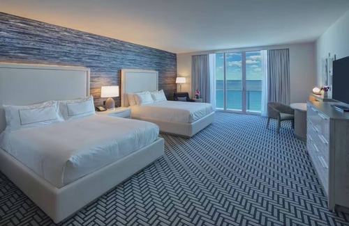 Central Beach Hotel | Warm and Inviting Beach Room with Private Balcony Overlooking the Marina