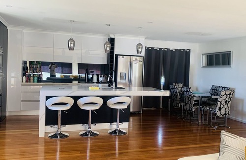 Banksia Beach House | Water front house with magical sunsets