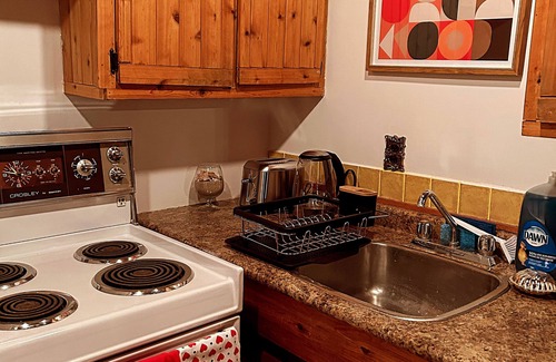 Saint Ambroise Cottage | Water's Edge cedar cabin on 1 acre lakefront: a perfect retreat summer or winter