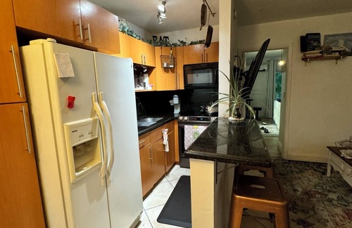 North Miami Condo | Waterfront Condo with Fishing, Paddleboard, and yard access.