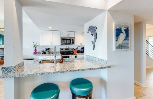 Harbor Oaks House | Waterfront condo with balcony, private boat slip, fishing pier, pools, & tennis