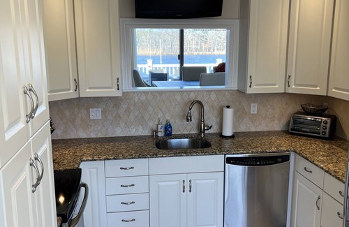 Great River House | Waterfront home, deck, bbq, fire pit, boats, hot tub, and more!