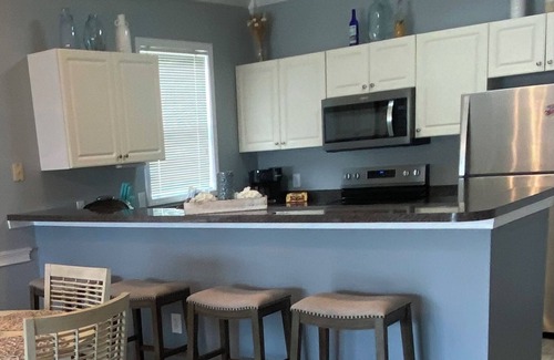Little River Condo | Waterway views, beautiful sunsets, pools, hot tubs, balcony, grilling & beaches