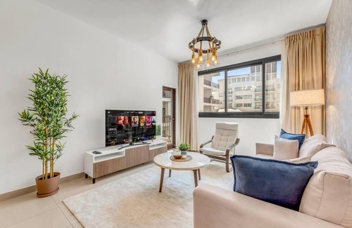 Jumeirah Village Circle Apartment | Waves - Comfortable 1BR Getaway in JVC With Park Views