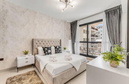 Jumeirah Village Circle Apartment | Waves - Comfortable 1BR Getaway in JVC With Park Views