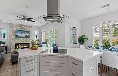 Poinsettia Heights House | Welcome to Blue Haven, A Charming Tropical Heated Pool Home, Centrally Located!
