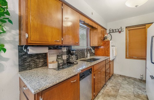 Waterloo House | Welcoming 2-bedroom home with large deck and central location.