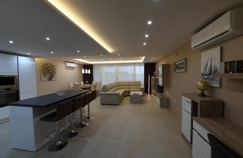 Qala Apartment | Wileg 4B Luxury Two Bedroom Apartment with Shared Swimming Pool.
