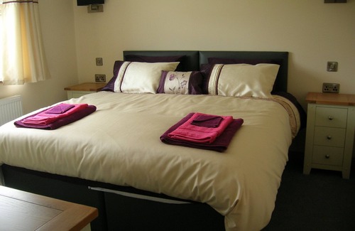 Hundred House Cabin | Woodland Lodge - A Five star luxury lodge with hot tub under cover.