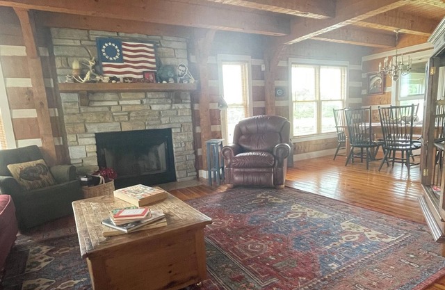 3 story log home with walkout basement, 27 acres, & pond in central Pike County!