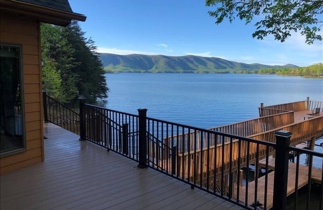 4 Bedrooms, 3 Full Bathrooms, 2 Half Bathrooms! Mystic Mountain w/log cabin & SANDY BEACH!