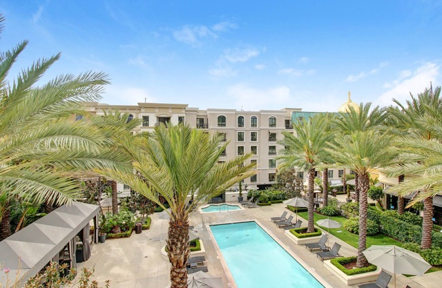 4th floor 2B/2bath with private balcony overlooking the pool at the Americana!