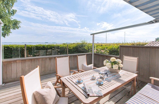 5 star holiday home with unobstructed sea views, direct waterfront and a private boat.
