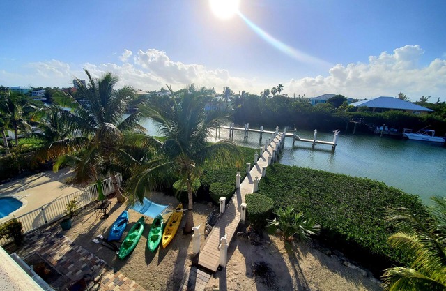 5BR luxury home w/pool, theater, rooftop deck & 100-ft dock near beach!