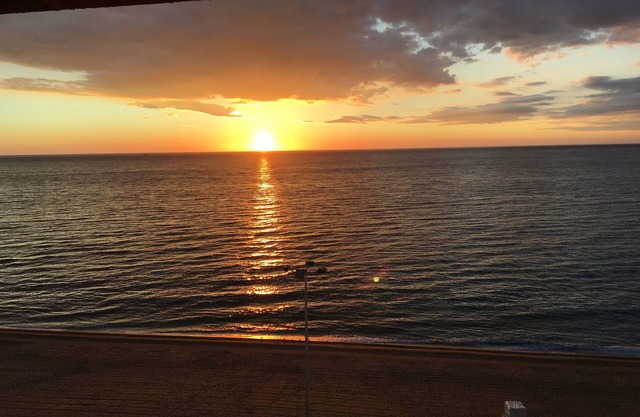 A balcony overlooking the sea.