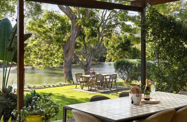 A delightful riverside house -comfortable and stylish - in Urunga