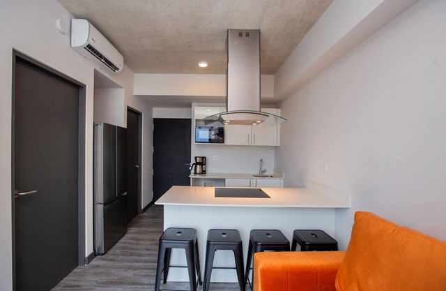 Aesthetic, centric building with multiple amenities and activities.