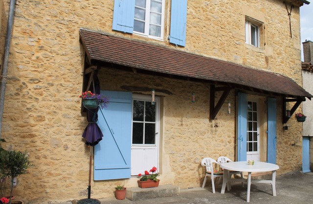An exclusive Village Holiday Cottage in the Dordogne. Log fire & private terrace