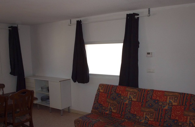 apartment with a large living room and 2 bedrooms, 6 individual beds