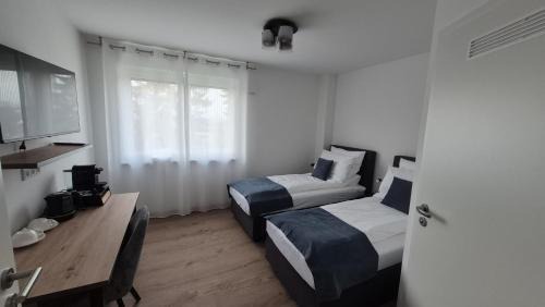Apartments Seibel Doppel-Zweibettzimmer mit Bad