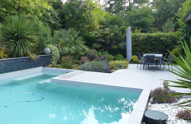 Architectural villa with private pool in a green setting