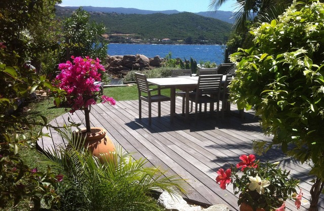 At the water's edge, a pretty blue house.
