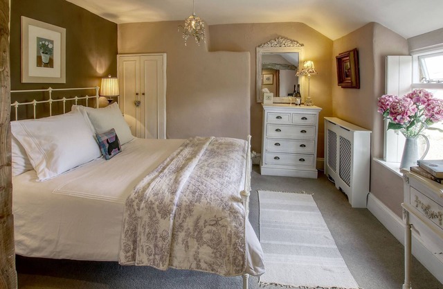 Bay Tree Cottage is tucked away in an elevated position on the edge of a pretty village.